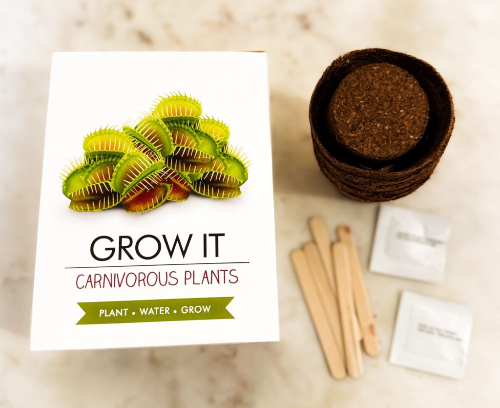 Grow It Carnivorous Plant kit laid out on table