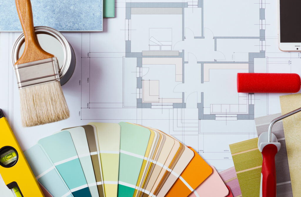 Decorator's work table with tools and paint colours