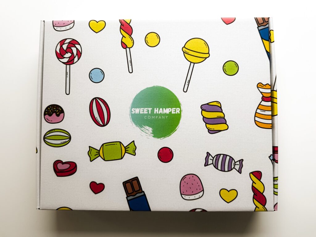Sweet box hamper from the outside - white box with sweets and lollys illustrations