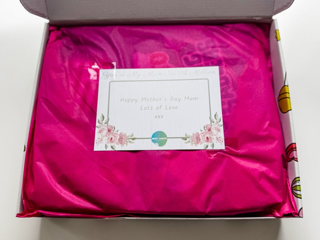 Personalised message for Mother's Day and pink wrapping paper inside the sweet box hamper