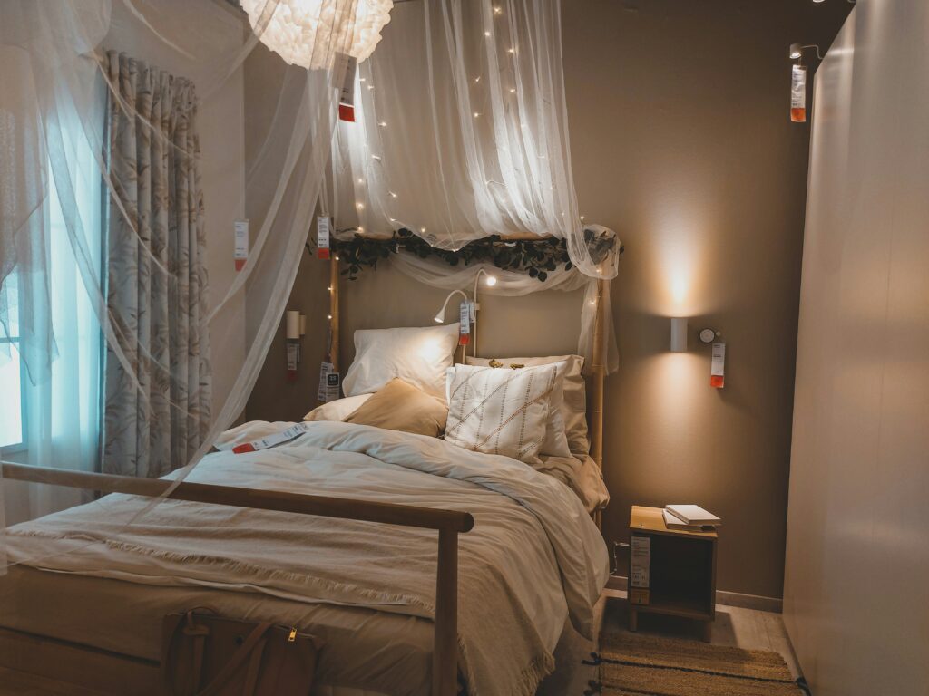 Double bed in bedroom with soft lighting to set a relaxing and romantic mood