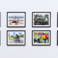 A white wall with family photos on display