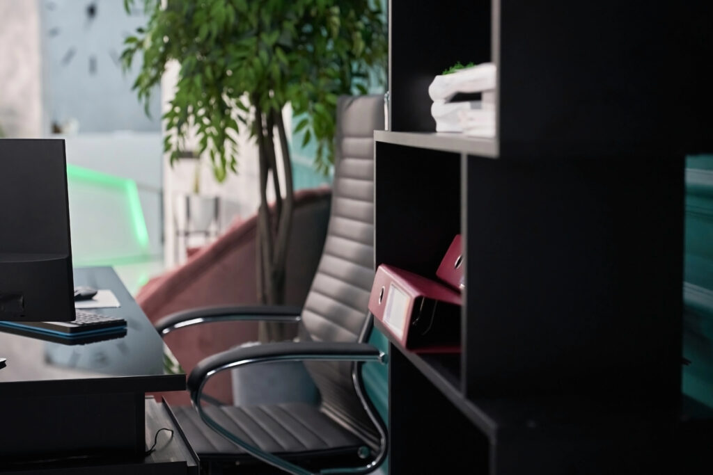 A home office with an elegant desk, ergonomic chair, minimalist style