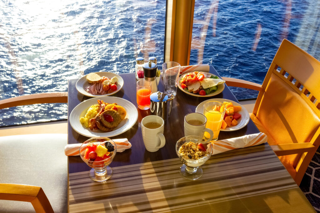 Cruise ship at breakfast with delicious colourful bright food laid out on a waterfront table