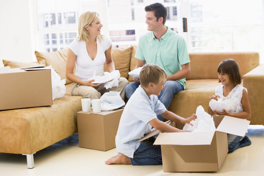 Family unpacking in their new city apartment