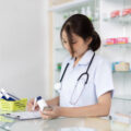 Pharmacist looking at prescription