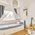 Small bedroom with smart furniture and layout to maximise the space