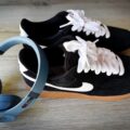 black mens nike trainers and headphones