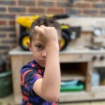 Boy showing how tough TONKA trucks are