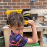Boy showing how tough TONKA trucks are